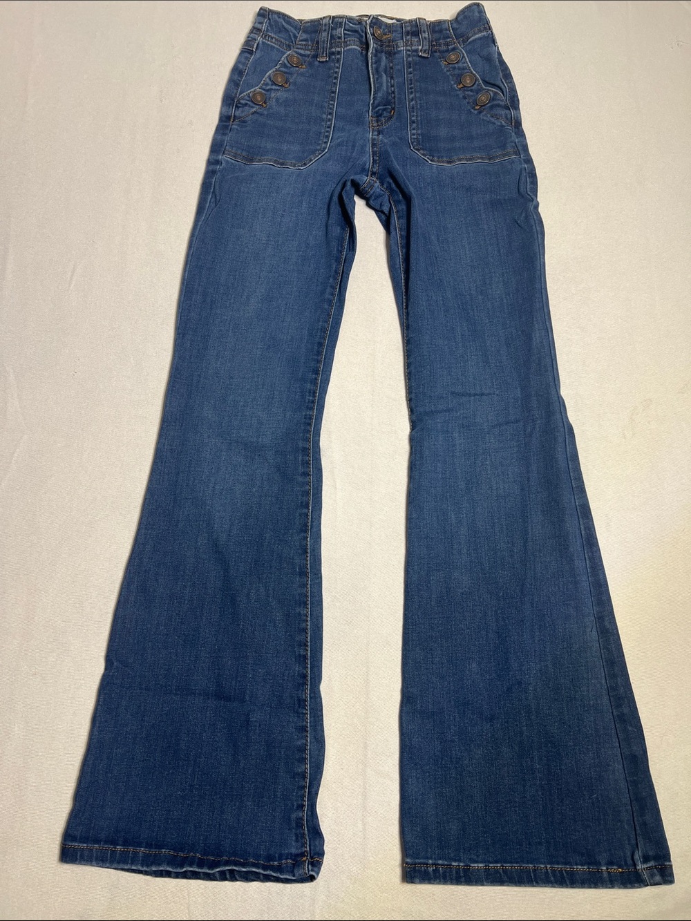 High-Rise Dark Blue Flare Jeans with Button-Accent Pockets